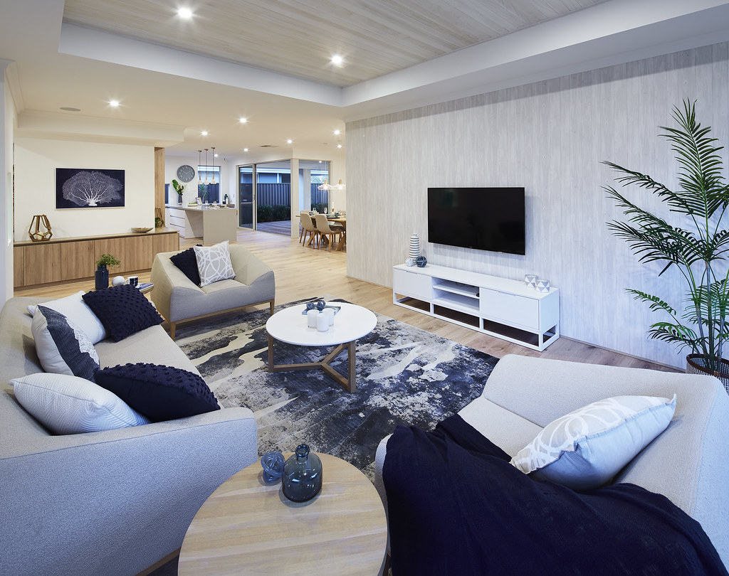 Living room with wall-mounted TV and sofa