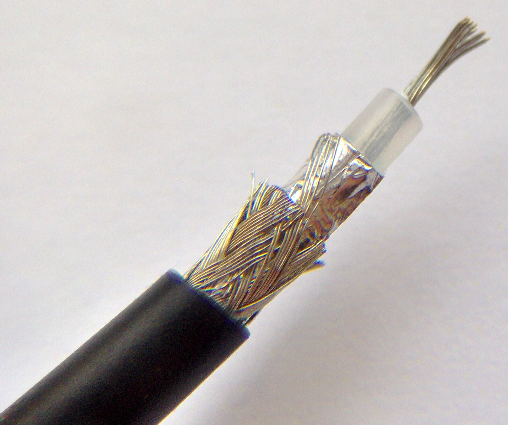 Close-up of a stripped coaxial cable end showing the shielding and center conductor